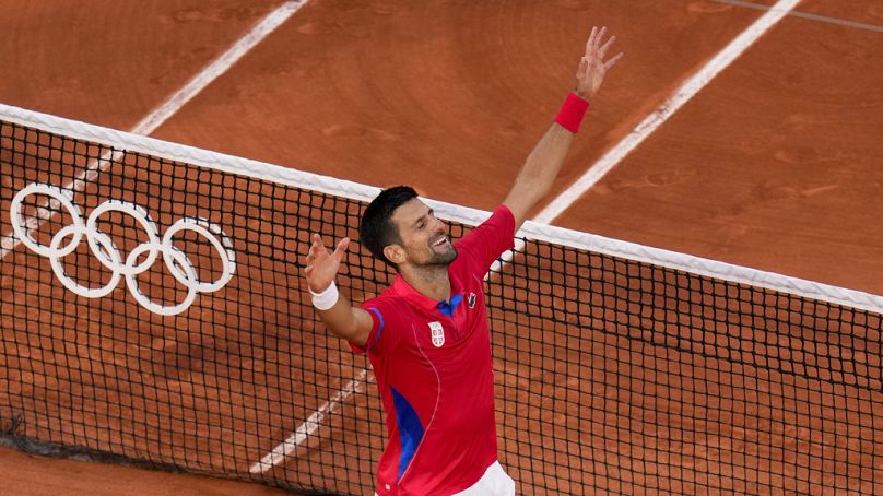 Novak Djokovic of Serbia celebrates after defeating Lorenzo Musetti of Italy in their men's singles semifinals tennis match, at the 2024 Summer Olympics, Friday, Aug. 2, 2024