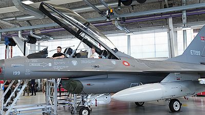 Ukrainian President Volodymyr Zelenskyy, left, and Denmark's Prime Minister Mette Frederiksen sit in a F-16 fighter jet at Skrydstrup Airbase, in Vojens, Denmark,2023.