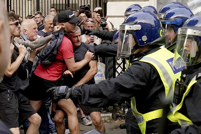 Protesters clash with police during the "Enough is Enough" protest in Whitehall, London, following the fatal stabbing of three children 