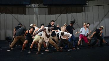 Dancers rehearse for "Dance of the Games" at the concert hall in Creteil, east of Paris, Wednesday July 31, 2024