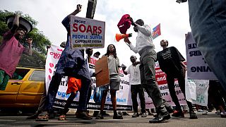 People protest over economic hardship on a street in Lagos, Nigeria, Monday, Aug 5, 2024.