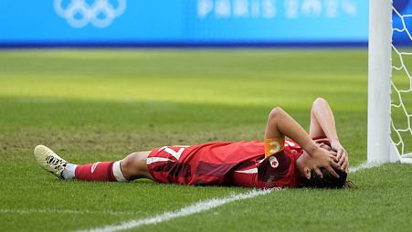 Canada's Jessie Fleming reacts on the ground during a women's quarterfinal soccer match between Canada and Germany at the 2024 Summer Olympics, Saturday, Aug. 3, 2024.