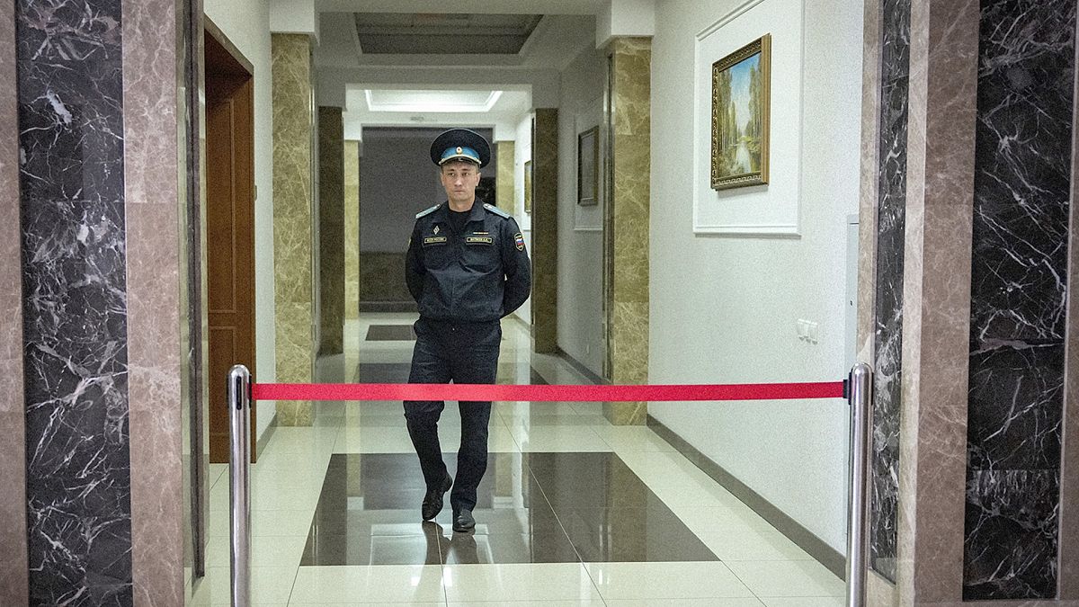 A Russian Federal Bailiffs Service officer guards a corridor leading to a courtroom inside the court in Yekaterinburg, 18 July 2024