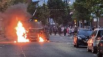 A vehicle is set alight in Belfast, Northern Ireland, following an anti-Islamic protest outside Belfast City Hall.