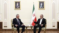 President Masoud Pezeshkian (right) speaks with secretary of Russia's Security Council Sergei Shoigu during their meeting at his office in Tehran, Iran, Monday, Aug. 5, 2024.