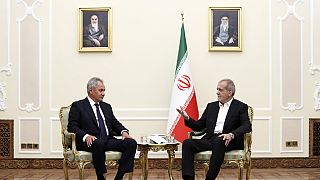 President Masoud Pezeshkian (right) speaks with secretary of Russia's Security Council Sergei Shoigu during their meeting at his office in Tehran, Iran, Monday, Aug. 5, 2024.