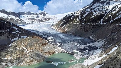 A lake of meltwater has formed on the tongue of the Rhone glacier near Goms, Switzerland, 13 June, 2023.