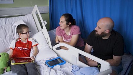 Reece and his parents after his surgery