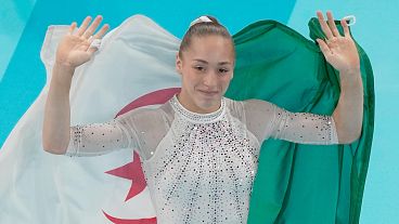 Algeria's Kaylia Nemour wins the gold medal during the women's artistic gymnastics individual uneven bars finals in Bercy Arena at the 2024 Summer Olympics, 4 August 2024