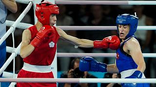 Taiwan's Lin Yu-ting, left, fights Turkey's Esra Yildiz in their women's 57 kg semifinal boxing match at the 2024 Summer Olympics