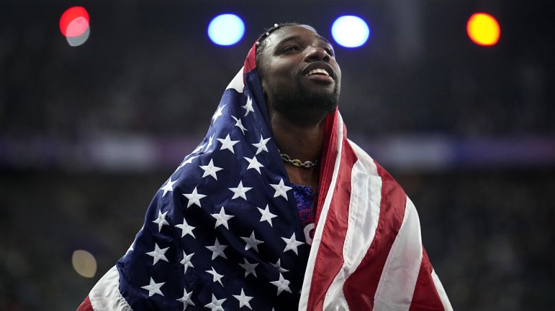 Noah Lyles, of the United States, celebrates after winning the men's 100-meter final at the 2024 Summer Olympics