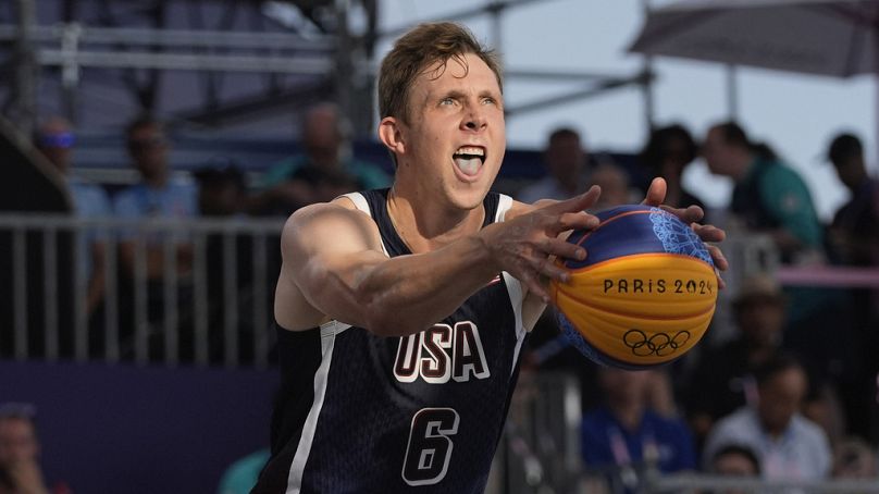 Canyon Barry (6), of the United States, makes a free throw in the men's 3x3 basketball pool round match against France during the 2024 Summer Olympics