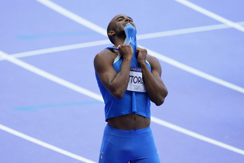 Diego Aldo Pettorossi, of Italy, reacts after finishing second in a men's 200 meters repechage heat at the 2024 Summer Olympics, Tuesday, Aug. 6, 2024, in Saint-Denis, France