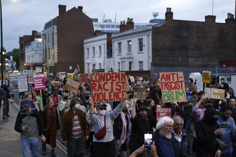 Counter protestors gather in Birmingham, England, Wednesday, Aug. 7, 2024