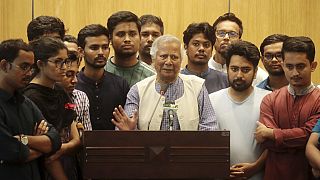 Nobel laureate Muhammad Yunus speaks to the media after his arrival at the airport in Dhaka, Bangladesh.