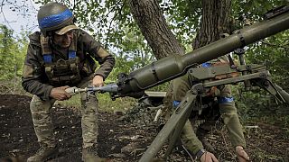 In this photo provided by Ukraine's 24th Mechanised Brigade press service, a serviceman of the 24th Mechanised Brigade fires an Easel Antitank Grenade Launcher SPG9.