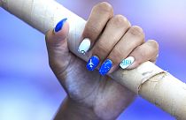 Uñas pintadas de una atleta en los Juegos Olímpicos. 