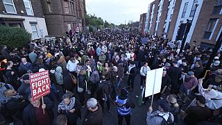 Counter protesters gather in Liverpool, Wednesday, Aug. 7, 2024 ahead of anti-immigration groups planning to target dozens of locations throughout the country.