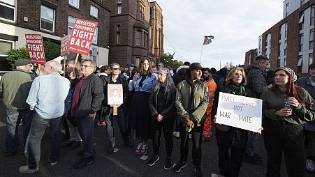 Counter protestors gather in Liverpool, Wednesday, Aug. 7, 2024 ahead of anti-immigration groups planning to target dozens of locations throughout the country following a week