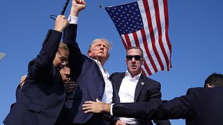 FILE - Republican presidential candidate former President Donald Trump surrounded by US Secret Service agents at a campaign rally, Saturday, July 13, 2024, in Butler, US. 