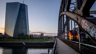 A tram drives past the European Central Bank building in Frankfurt, Germany.