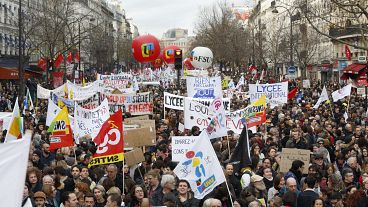 Protestors march in Paris over a proposed raise in the retirement age. Dec. 17, 2019.