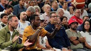 Travis Scott arrested in Paris after altercation with hotel security guard - pictured here at men's semifinals basketball game in Paris - Thursday 8 August 2024