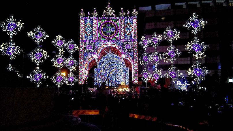 There are castellated entrance gates, arched tunnels, rose windows and domes decorated in multicoloured lights so the surfaces almost look like stained glass. 