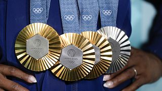 US gymnast Simone Biles displays her medals - will the Olympics turn France's finances gold, too?