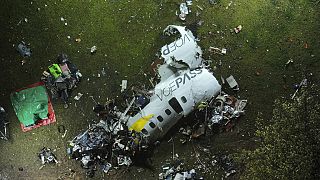 The debris at the site where an airplane crashed with 62 people on board, in Vinhedo, Sao Paulo state, Brazil, early on Saturday