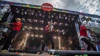 FILE - A band plays at Sziget Festival on Shipyard Island off Budapest, Hungary, Friday, August 12, 2022. 