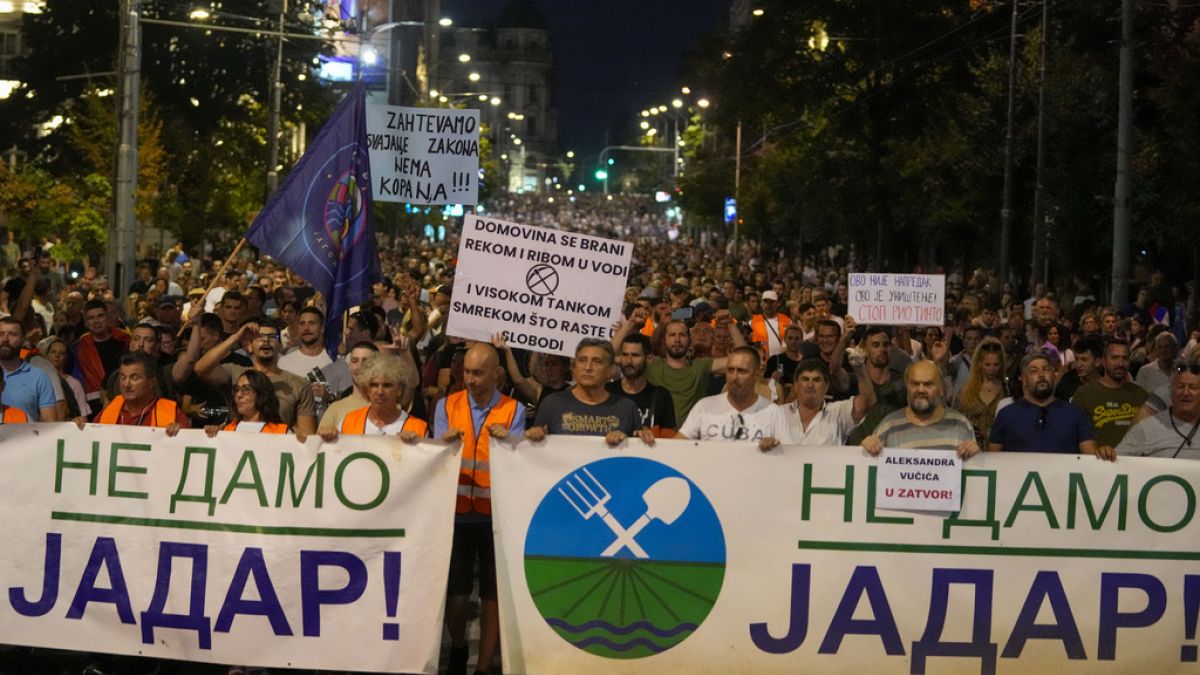 People hold banners reading, "We Won't Give up Jadar!" and march during a protest against pollution and the exploitation of a lithium mine in the country in Belgrade, Serbia, 