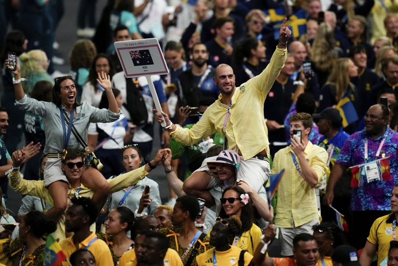 Athletes of Australia wave during the 2024 Summer Olympics closing ceremony at the Stade de France, Sunday, Aug. 11, 2024, in Saint-Denis, France