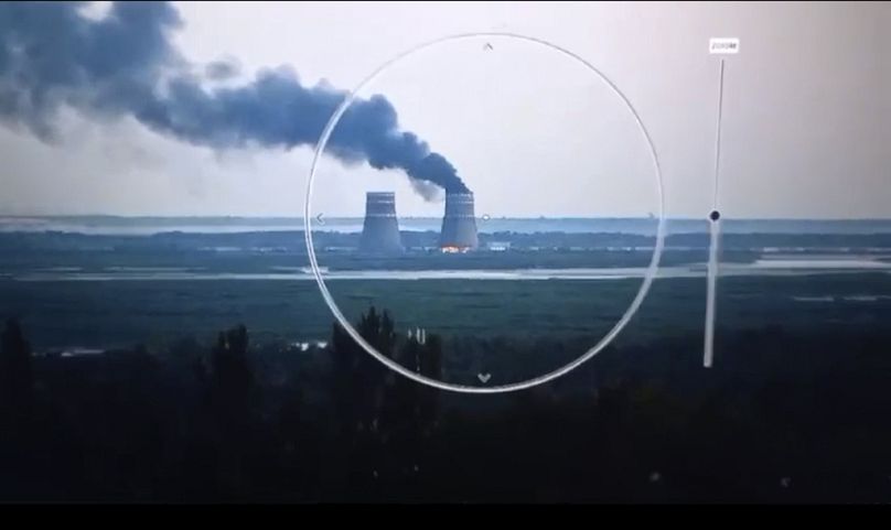 Smoke rises from a cooling tower of the Zaporizhzhia Nuclear Power Station in a Russia-controlled area in the Energodar, Zaporizhzhia region of Ukraine, Sunday, Aug. 11, 2024.