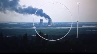 Smoke rises from a cooling tower of the Zaporizhzhia Nuclear Power Station in a Russia-controlled area in the Energodar, Zaporizhzhia region of Ukraine.