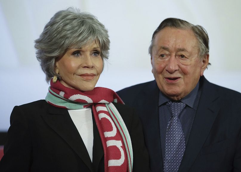 Actress Jane Fonda and businessman Richard Lugner arrive for a news conference on the Vienna Opera Ball.