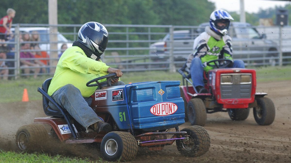 In this July 6, 2013 photo, the Southeast Missouri Lawnmower Racing Association races in Patton, Mo. 