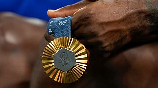 LeBron James holds his gold medal during a women's gold medal basketball game at Bercy Arena at the 2024 Summer Olympics, Sunday, Aug. 11, 2024, in Paris, France. 