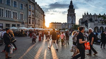 Tourists in Main Market Square Kraków, Poland Tourists in Main Market Square Kraków, Poland