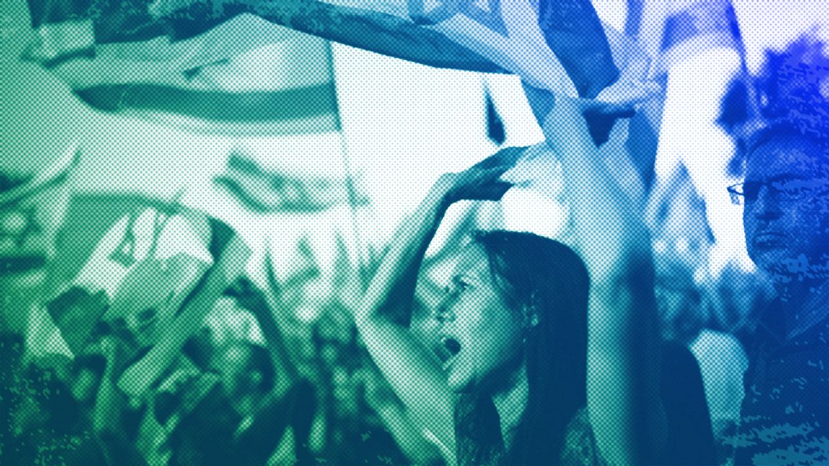 People wave Israeli flags during a protest against Israeli PM Benjamin Netanyahu's government and demanding elections outside of the Knesset, in Jerusalem, June 2024