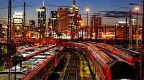 Trains are parked outside the central train station in Frankfurt, Germany, Wednesday, Aug. 11, 2021.