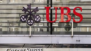 Logos of the Swiss banks Credit Suisse and UBS are seen on two buildings in Zurich