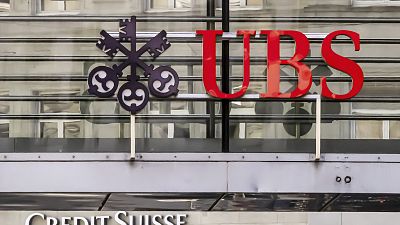 Logos of the Swiss banks Credit Suisse and UBS are seen on two buildings in Zurich