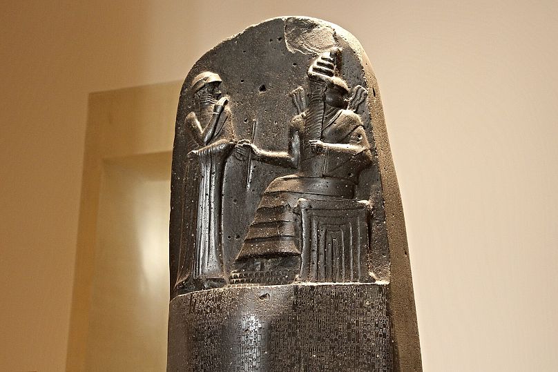 The top of the Code of Hammurabi stele, featuring an image of Hammurabi with Shamash, the Babylonian sun god and god of justice.