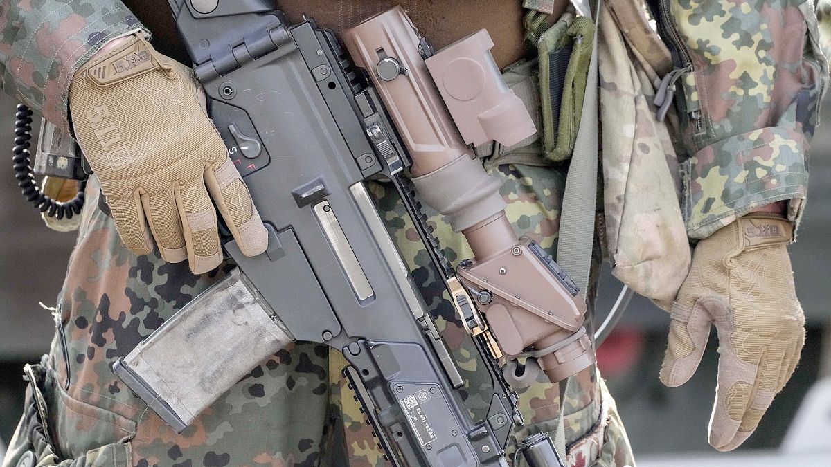 FILE: German soldiers stand with their battle gear at the army base Field Marshal Rommel Barracks in Augustdorf, 30 March 2022