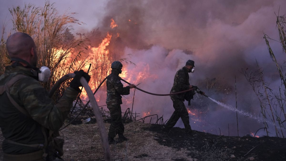 Greek opposition accuses government of mishandling wildfire that burned through Athens suburbs