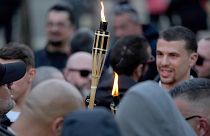 FILE: Supporters of the Portuguese nationalist movement 1143 light torches before staging a protest march under the slogan "Stop Islam" in downtown Lisbon, 3 February 2024