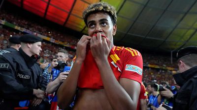 Spain's Lamine Yamal celebrates after winning the final match between Spain and England at the Euro 2024 tournament in Berlin.