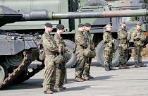 FILE: German soldiers stand at a Leopard tank during a visit of Governor Hendrick Wuest at the army base Field Marshal Rommel Barracks in Augustdorf, 30 March 2022