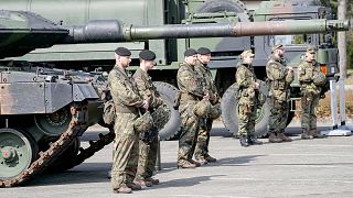 FILE: German soldiers stand at a Leopard tank during a visit of Governor Hendrick Wuest at the army base Field Marshal Rommel Barracks in Augustdorf, 30 March 2022